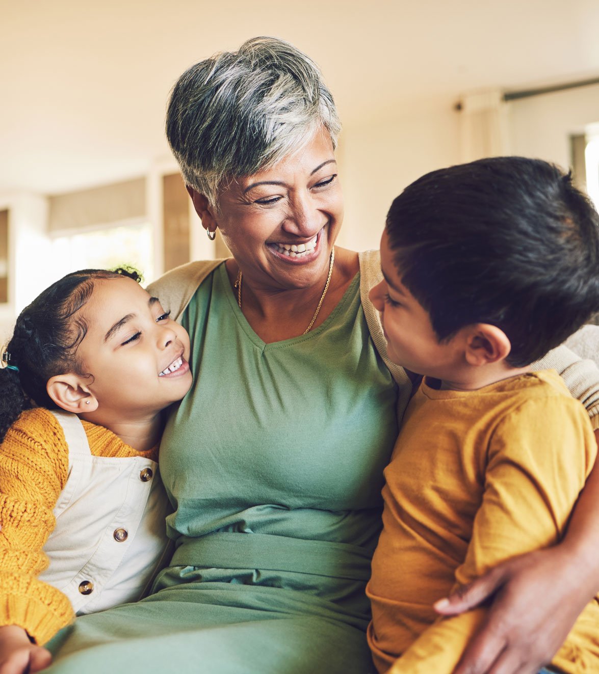hug-grandmother-or-happy-kids-on-a-sofa-with-love-2023-11-27-05-35-48-utc
